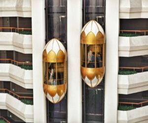 two gold capsule elevator